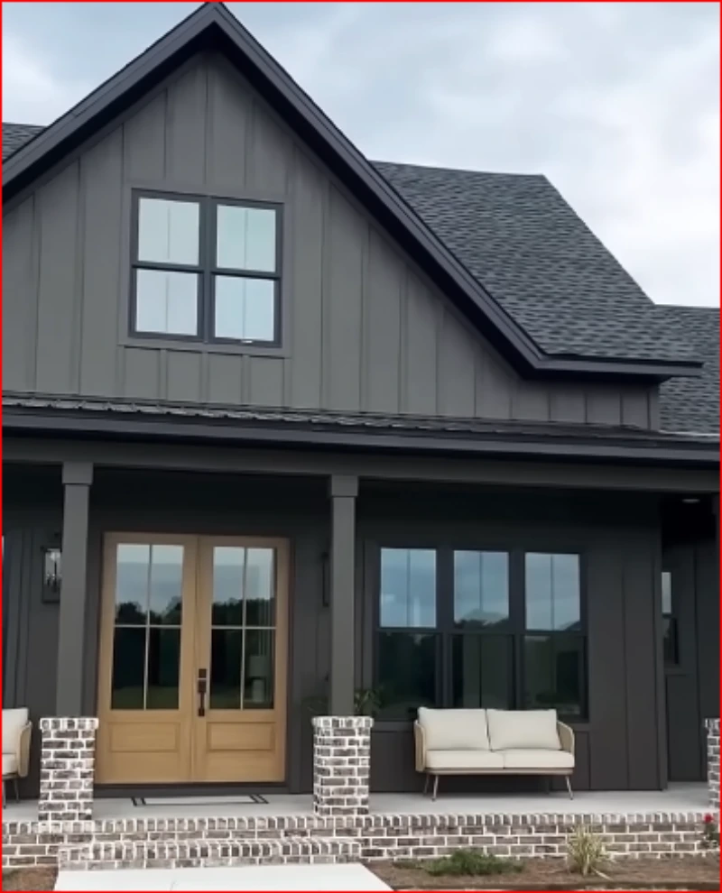 Modern farmhouse-style home with large front windows and glass entry doors