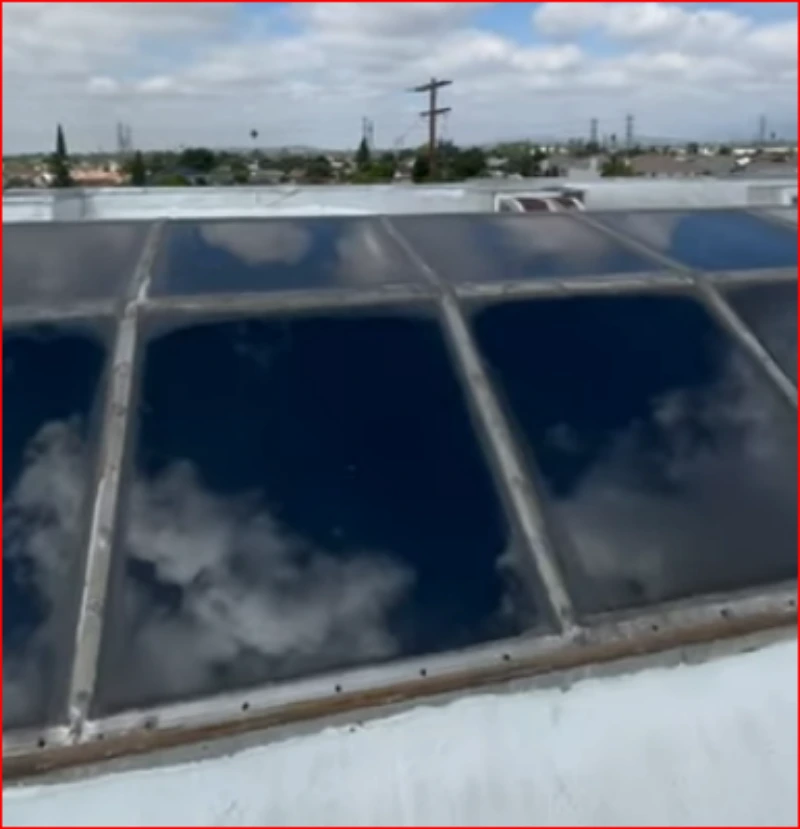 Large rooftop skylight panels ready for cleaning, the kind of high glass that needs roof access