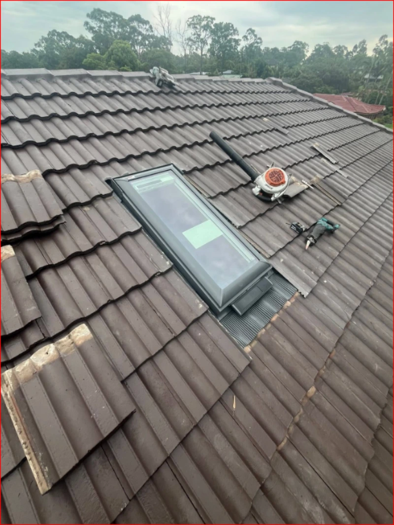 Skylight set into a tiled roof, the kind that needs roof access to clean outside